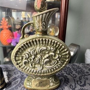 Ornate Green Vase with Intricate Design and Scalloped Rim